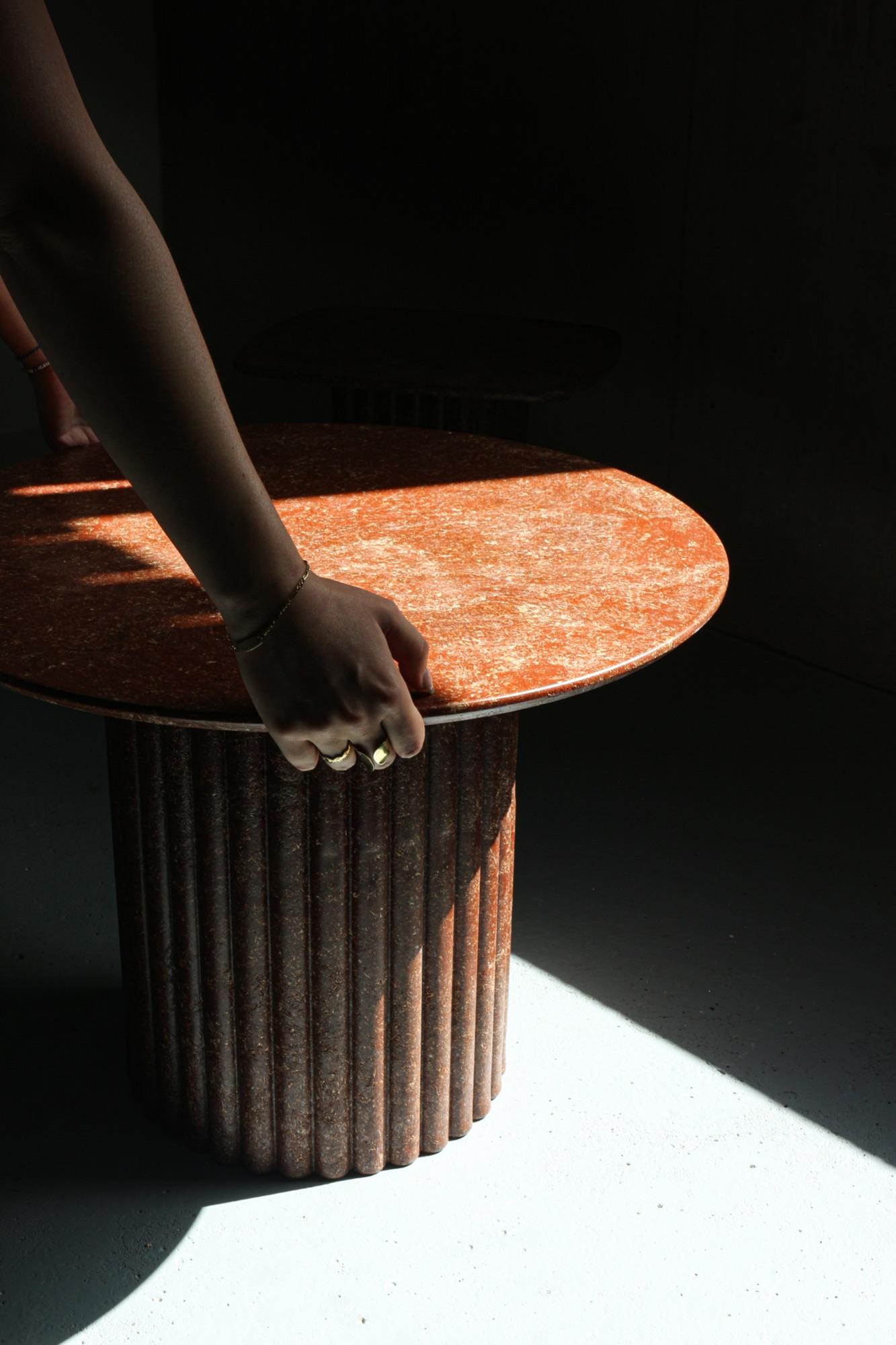 Citra recycled coffee table — amber Balt®, hand detail, lifestyle